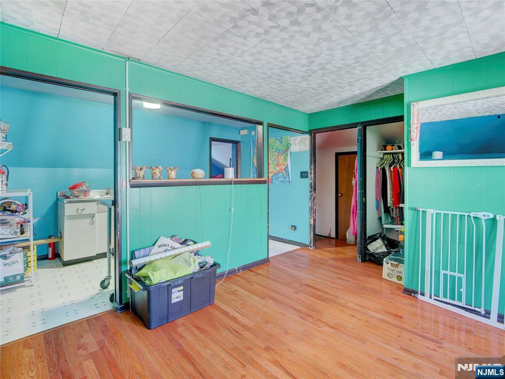 416 Jerusalem Road Scotch Plains, NJ 07076 - Photo 13 of 26 a room with furniture and a wooden floor