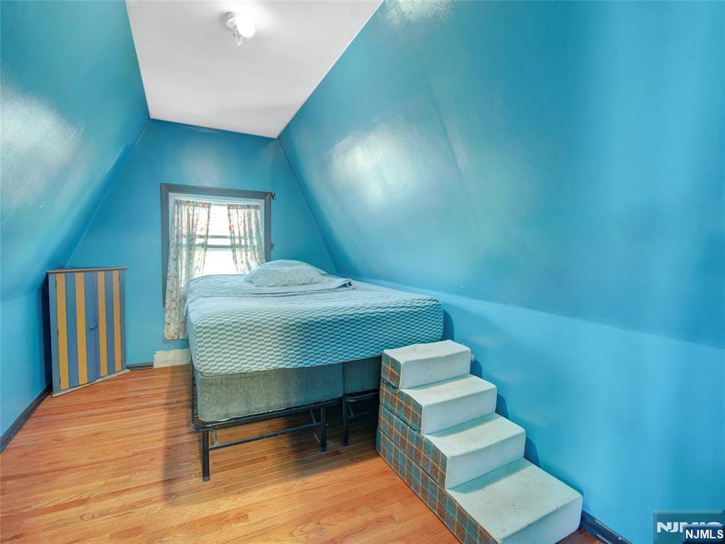 416 Jerusalem Road Scotch Plains, NJ 07076 - Photo 14 of 26 a view of hall way with furniture and wooden floor