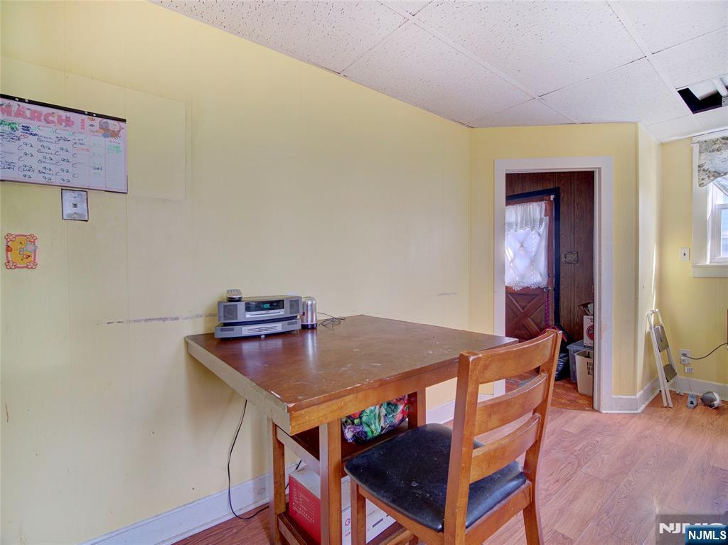 416 Jerusalem Road Scotch Plains, NJ 07076 - Photo 18 of 26 a view of a dining room with furniture and wooden floor