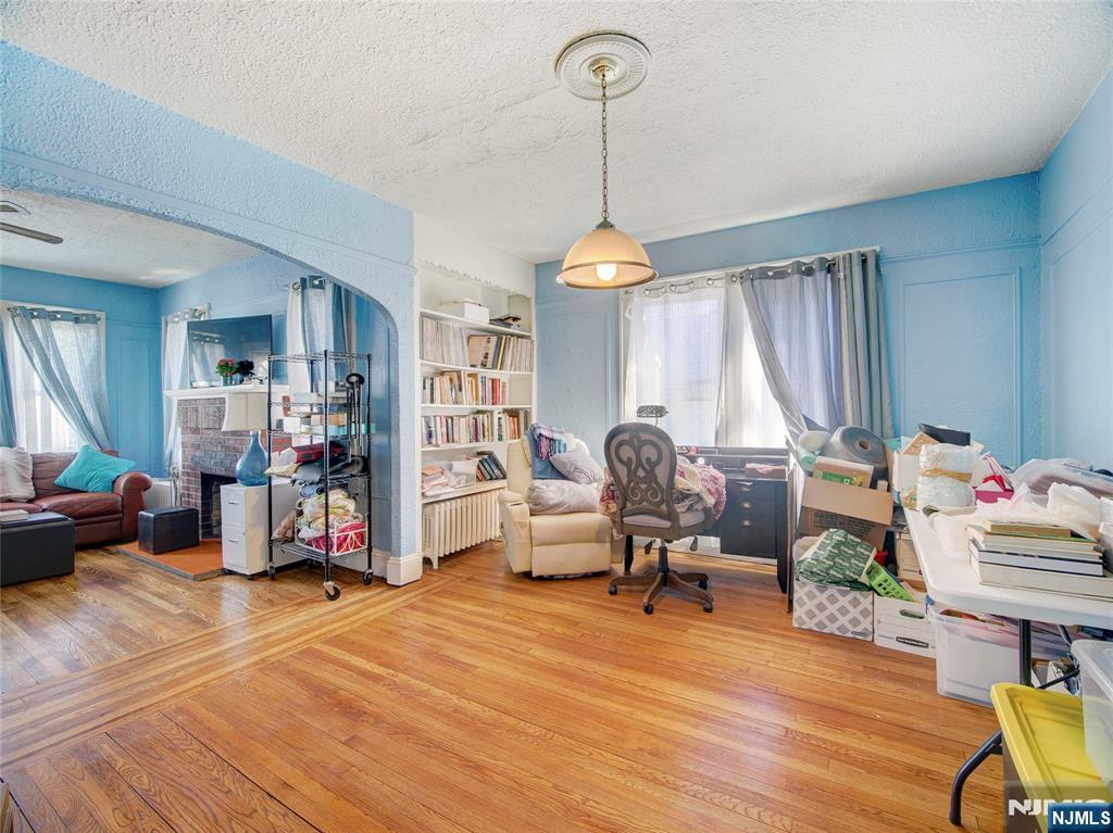 416 Jerusalem Road Scotch Plains, NJ 07076 - Photo 20 of 26 a living room filled with furniture and a chandelier