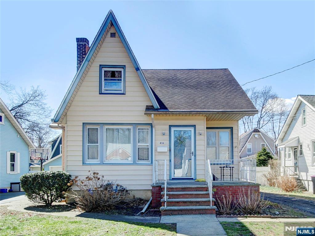 416 Jerusalem Road Scotch Plains, NJ 07076 - Photo 2 of 26 a front view of a house with a yard