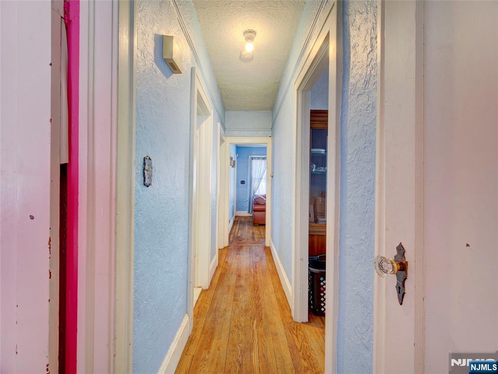 416 Jerusalem Road Scotch Plains, NJ 07076 - Photo 26 of 26 a view of a hallway with a livingroom and furniture