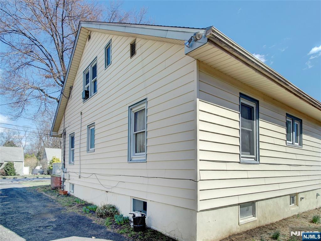 416 Jerusalem Road Scotch Plains, NJ 07076 - Photo 4 of 26 a view of a house with a yard