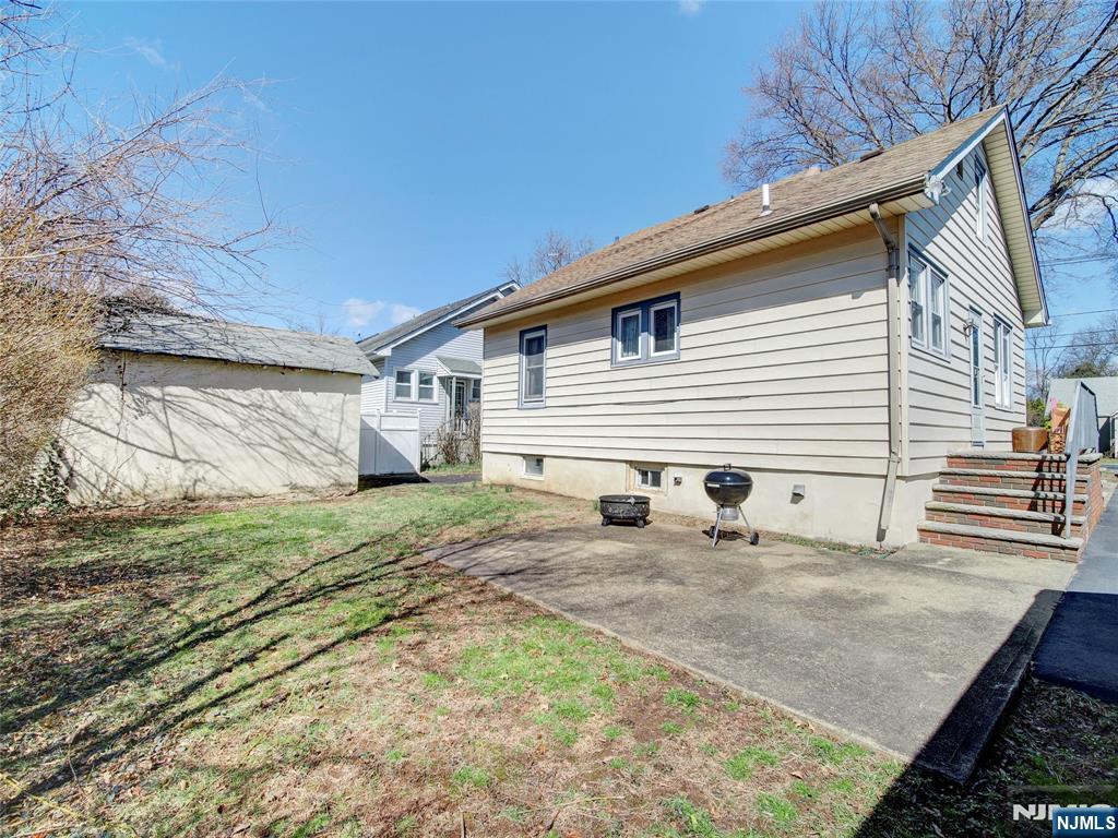 416 Jerusalem Road Scotch Plains, NJ 07076 - Photo 6 of 26 a view of a backyard with a large tree