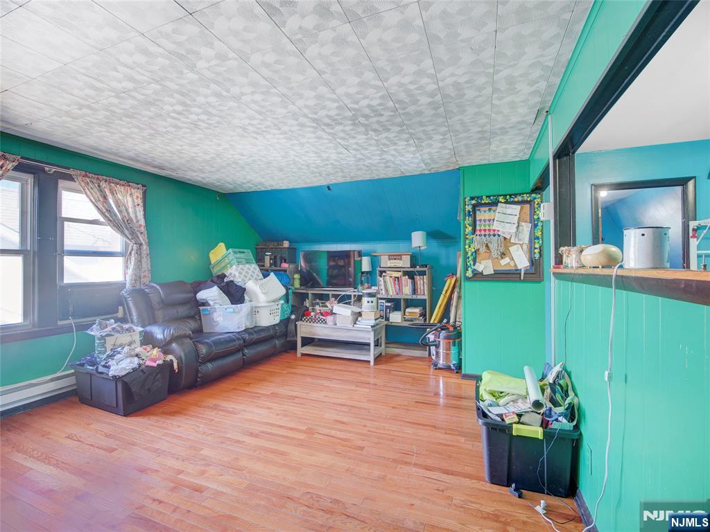 416 Jerusalem Road Scotch Plains, NJ 07076 - Photo 10 of 26 a living room with furniture and a fireplace