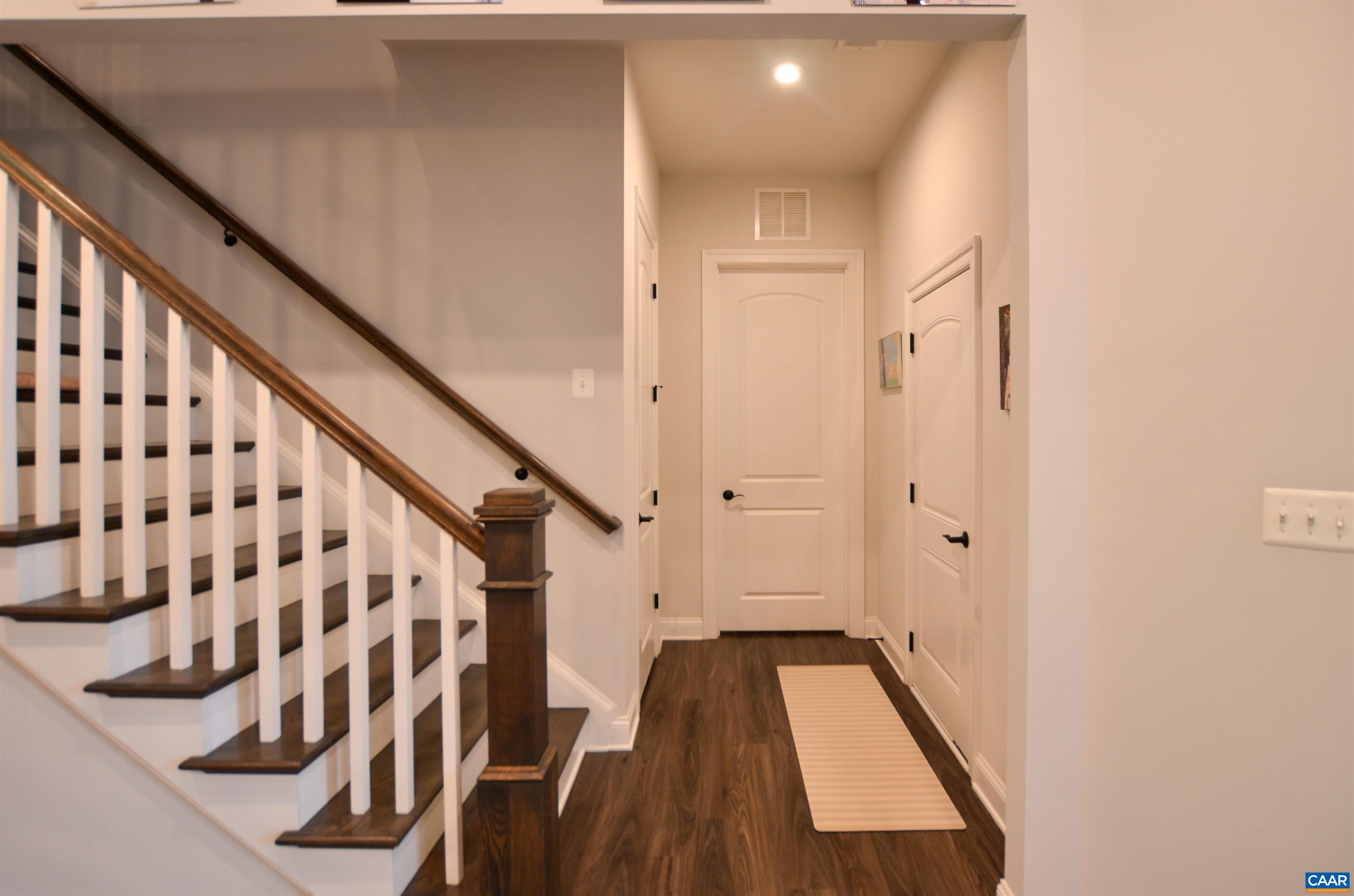327 Claibourne Road Crozet, VA 22932 - Photo 24 of 36 a view of a hallway with wooden floor and staircase