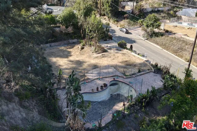 a view of a yard with trees