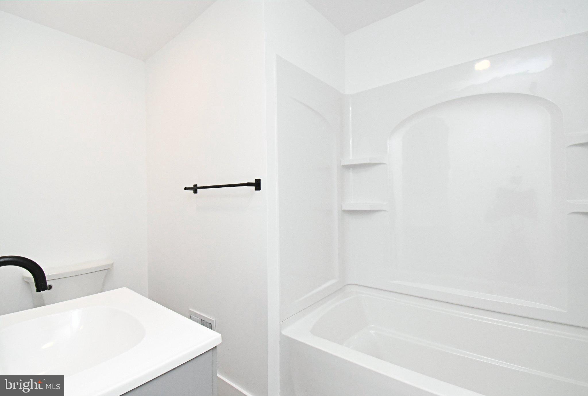 64 North Main Street Spring City, PA 19475 - Photo 16 of 26 Sleek, modern bathroom retreat.