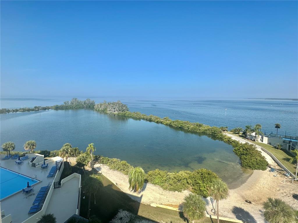a view of a ocean with outside a house