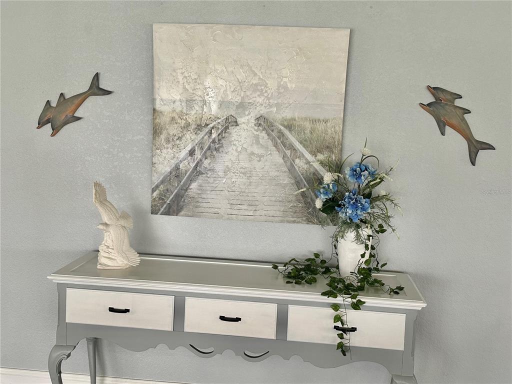 6009 Sea Ranch Drive, Unit 804 Hudson, FL 34667 - Photo 47 of 73 a vase of flowers sitting on a table