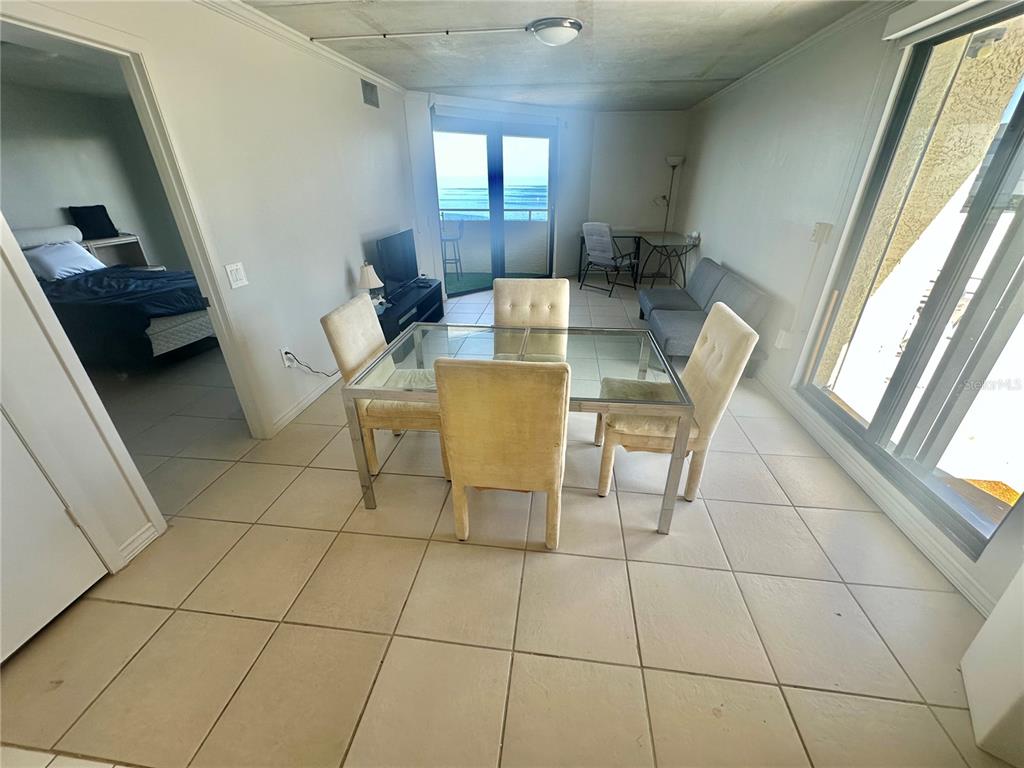 6009 Sea Ranch Drive, Unit 804 Hudson, FL 34667 - Photo 5 of 73 a view of a dining room with furniture and a window