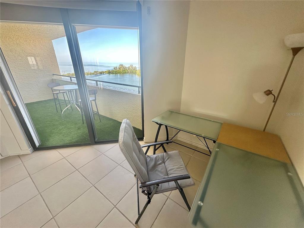 6009 Sea Ranch Drive, Unit 804 Hudson, FL 34667 - Photo 10 of 73 a bedroom with a bed and a window