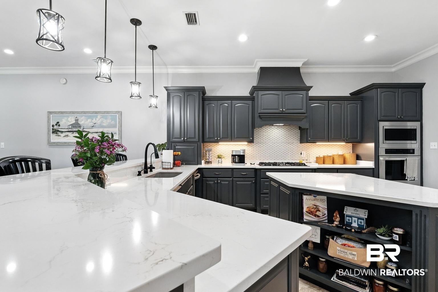 23357 Carnoustie Drive Foley, AL 36535 - Photo 41 of 99 Kitchen featuring backsplash, crown molding, light stone counters, a peninsula, and stainless steel appliances