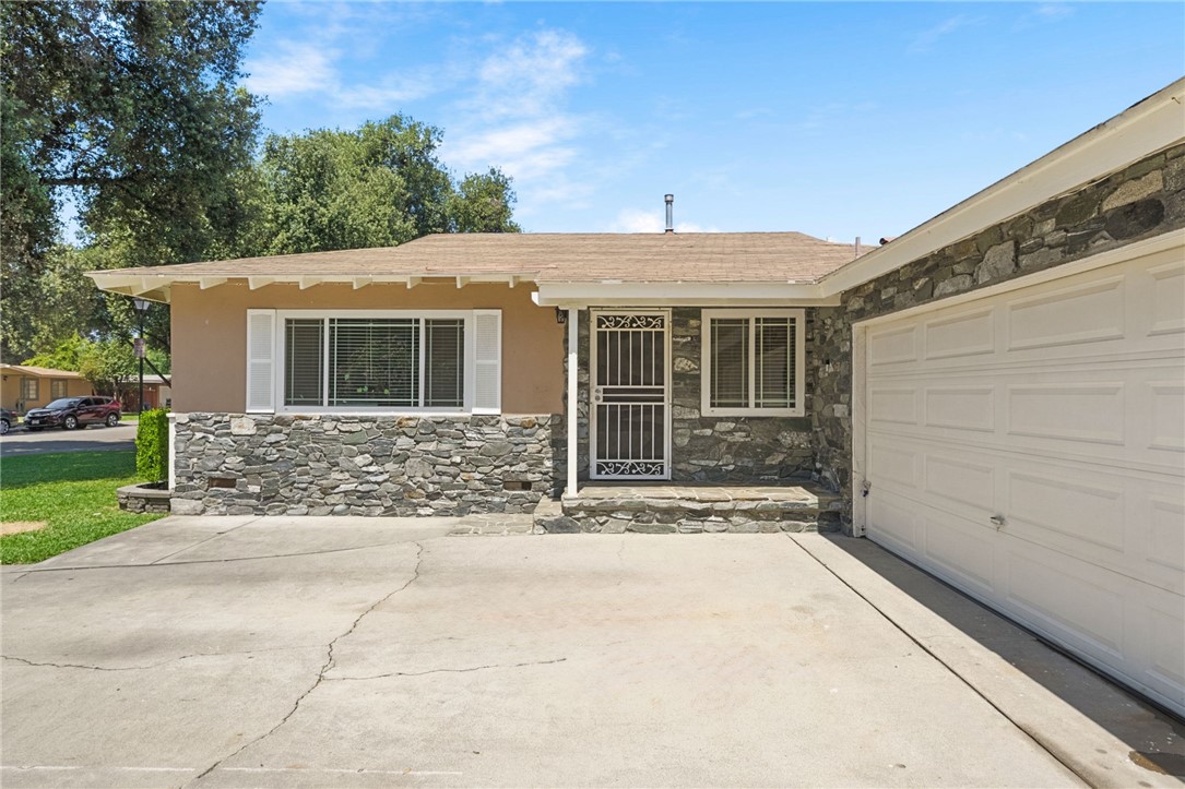 4869 Serrano Place Riverside, CA 92504 - Photo 12 of 40 Charming curb appeal highlighted by attractive stone accents, covered entry, and inviting front architecture.