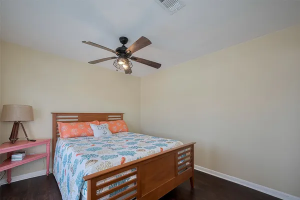 a bedroom with a bed and a flat tv screen