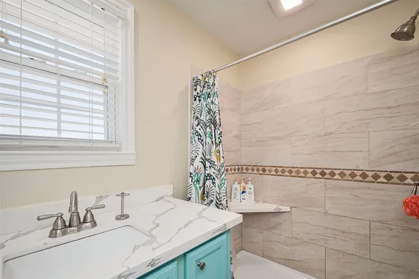 a bedroom with a bed and a chair