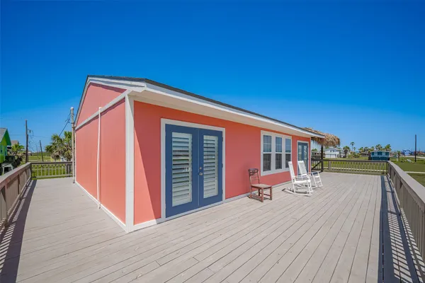 an aerial view of a house with a yard swimming pool and outdoor seating