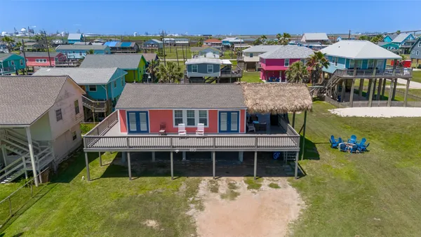 a view of house with outdoor space and balcony