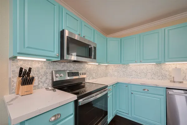 a kitchen with a stove and a microwave