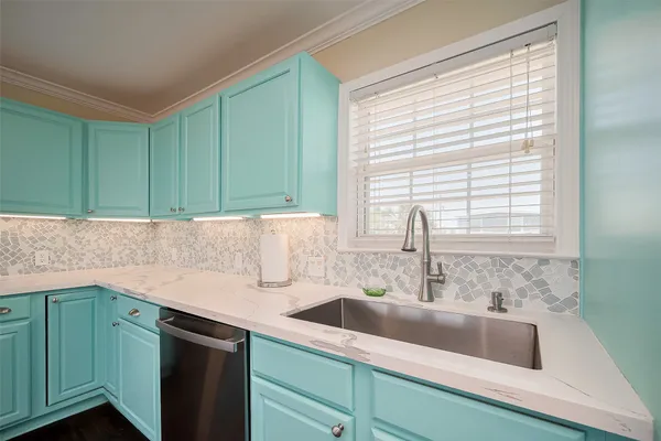 a view of a sink and a window