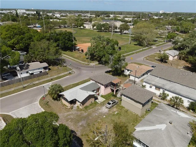 an aerial view of residential houses with outdoor space