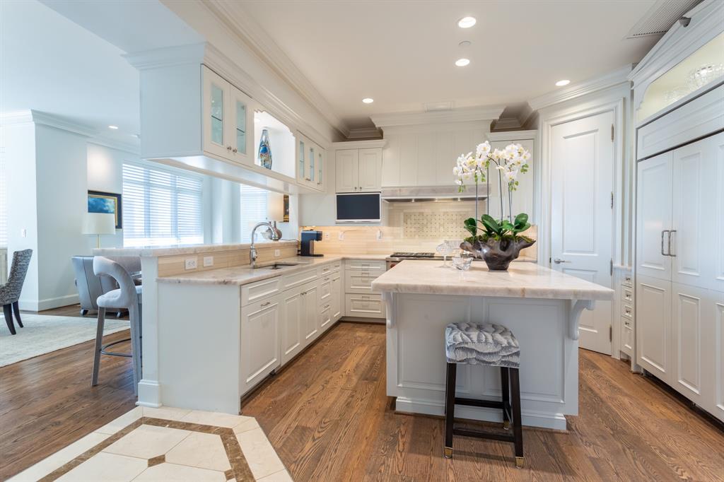 2525 North Pearl Street, Unit 1005 Dallas, TX 75201 - Photo 2 of 40 a kitchen with a sink cabinets and window