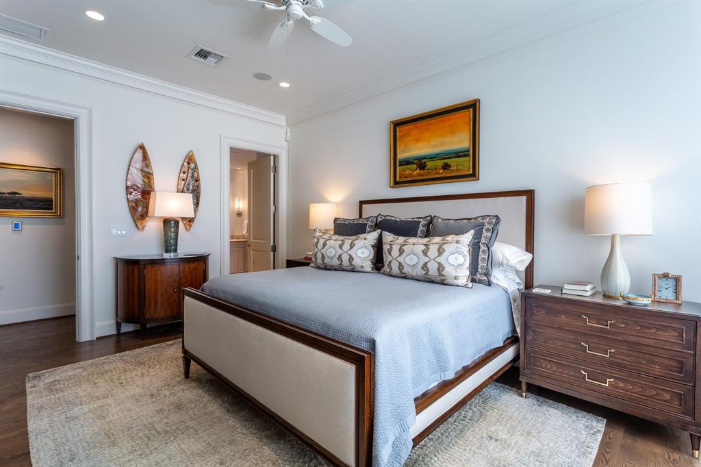 2525 North Pearl Street, Unit 1005 Dallas, TX 75201 - Photo 23 of 40 a bedroom with a bed and a dresser