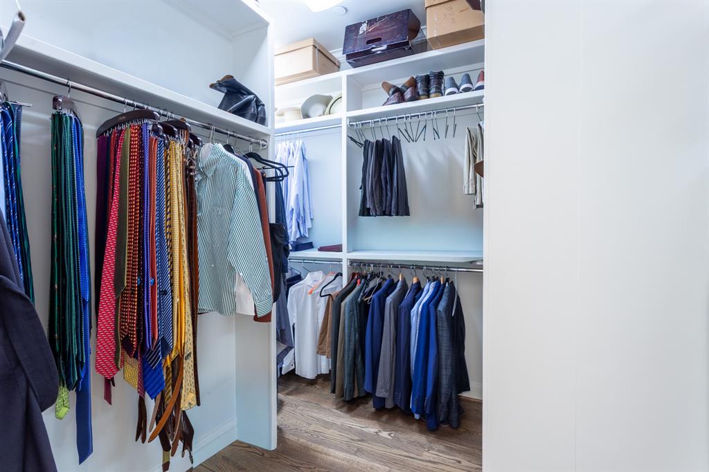 2525 North Pearl Street, Unit 1005 Dallas, TX 75201 - Photo 29 of 40 a view of walk in closet with clothes and shoes