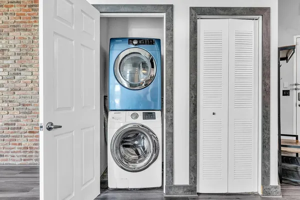 a view of a hallway with washer and dryer