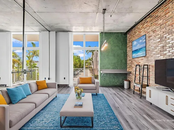 a living room with furniture and a flat screen tv