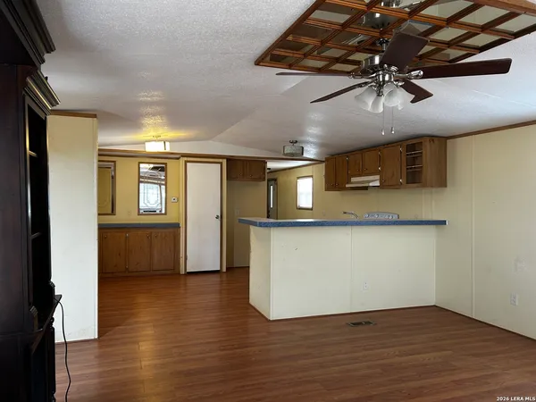 a view of kitchen with wooden floor