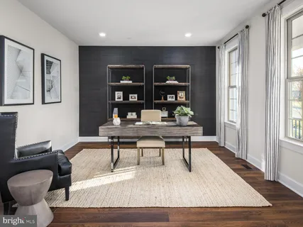 a workspace with furniture and window