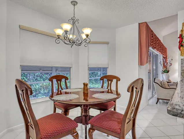a kitchen with a sink appliances and cabinets