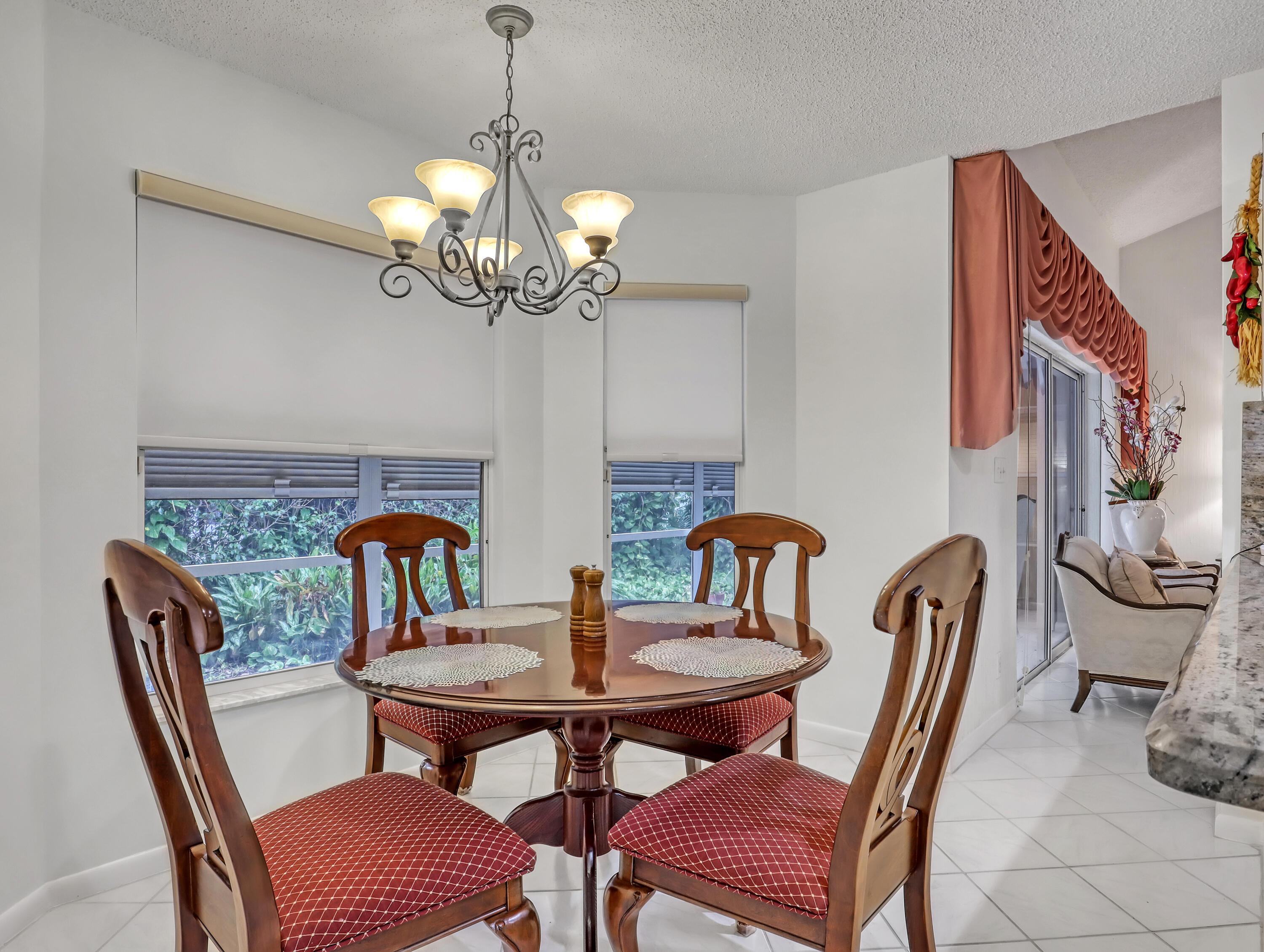 712 Golf Court Delray Beach, FL 33445 - Photo 17 of 46 a dining room with furniture and chandelier