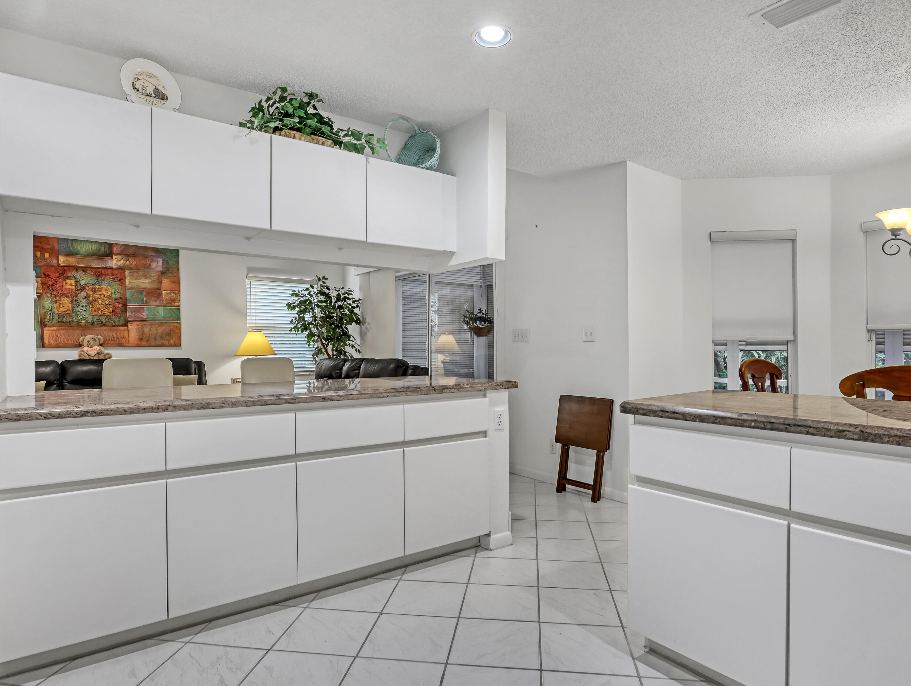 712 Golf Court Delray Beach, FL 33445 - Photo 20 of 46 a kitchen with a sink and cabinets