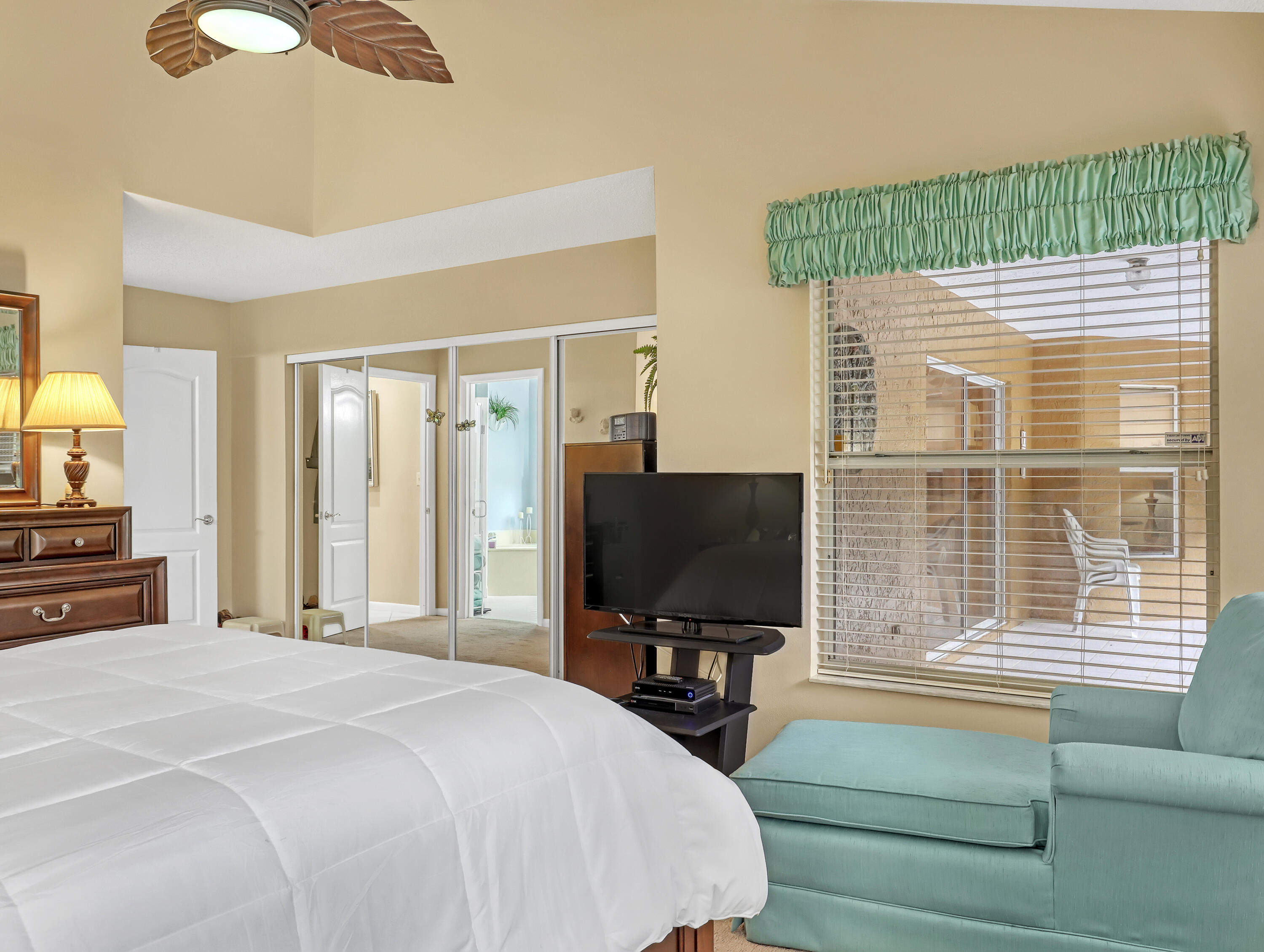 712 Golf Court Delray Beach, FL 33445 - Photo 25 of 46 a bedroom with a bed and a flat screen tv