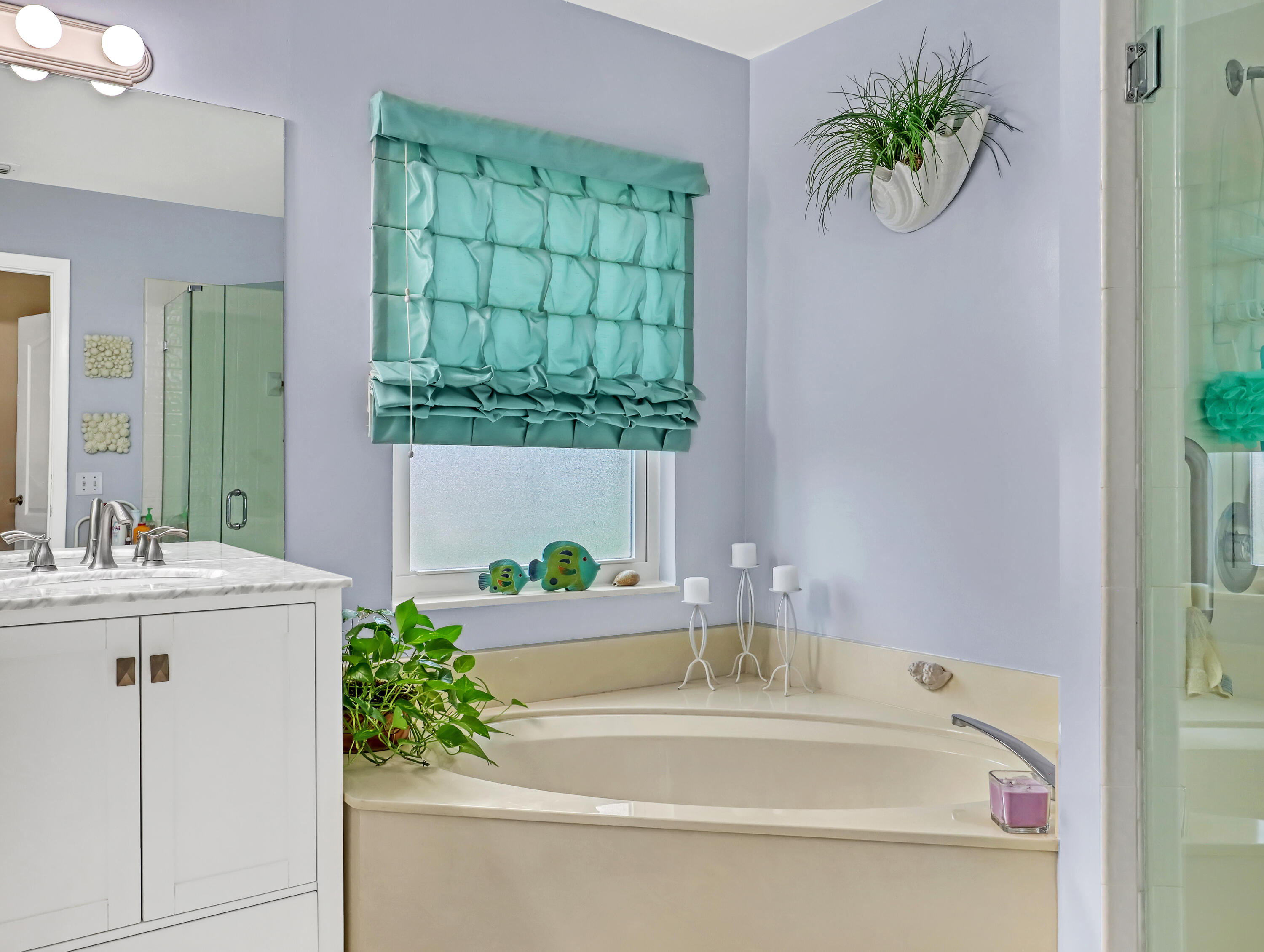 712 Golf Court Delray Beach, FL 33445 - Photo 26 of 46 a bathroom with a tub sink and mirror