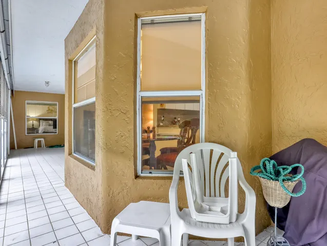 a view of a livingroom with furniture and a window