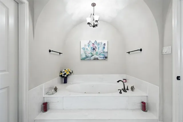 a bathroom with a bathtub and a sink