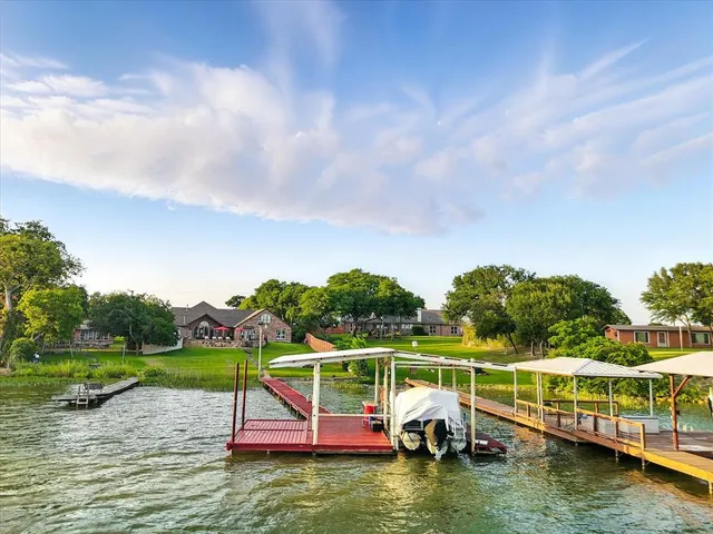 a view of a lake with a yard