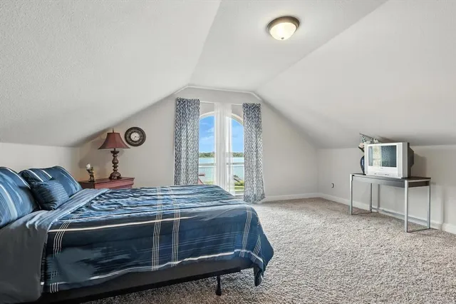 a bedroom with a bed and a desk