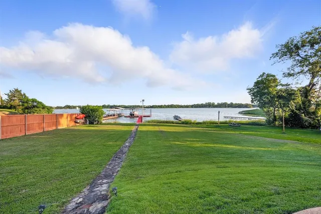 a view of a lake with a big yard