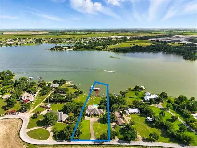 a view of a lake with a house in the background