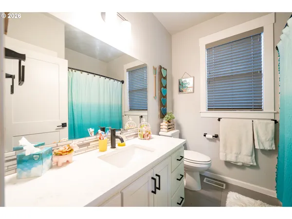 a bathroom with a sink double vanity and a mirror