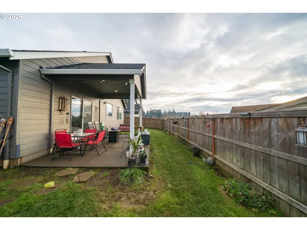 a view of a house with backyard and porch