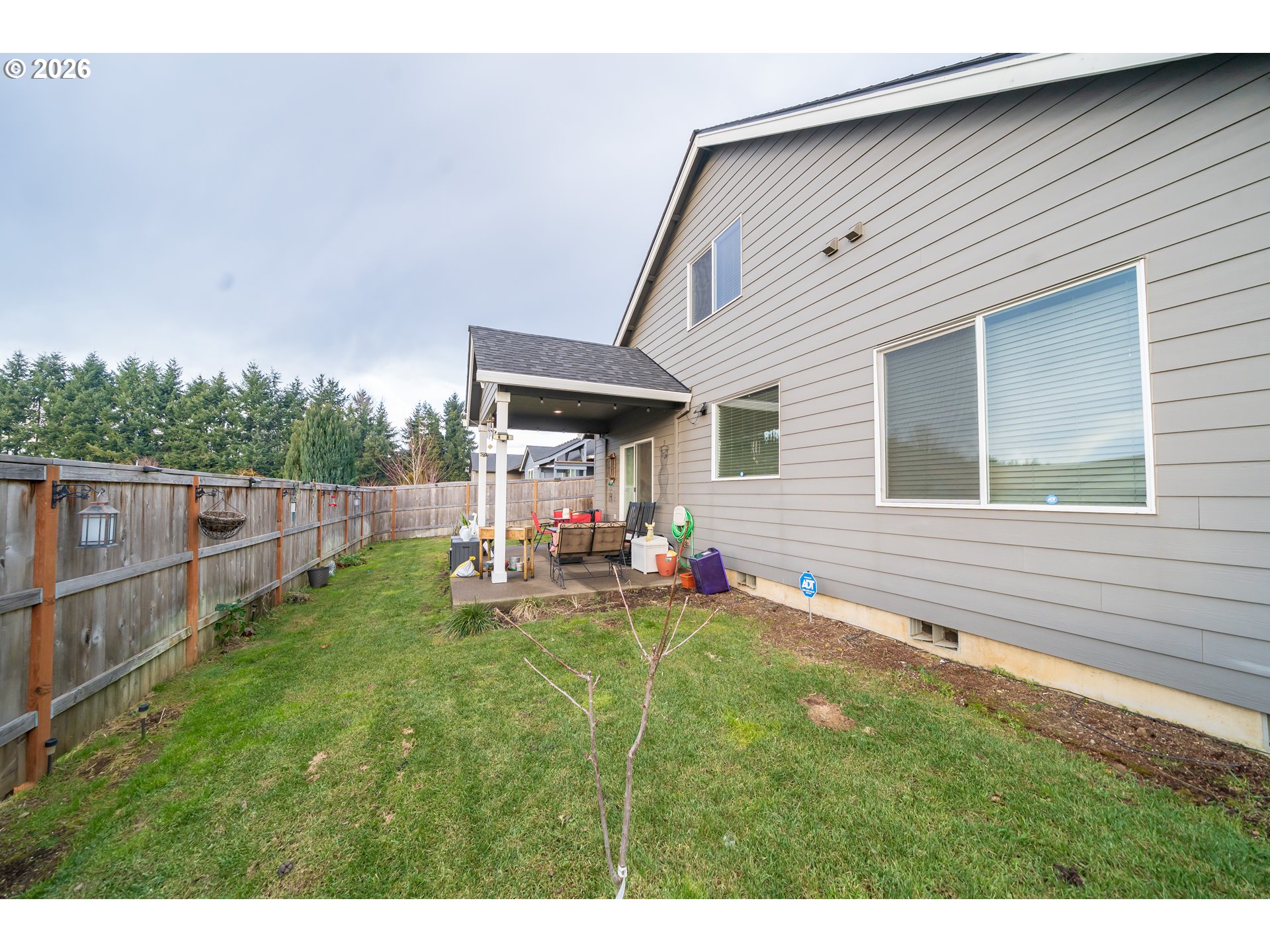 459 Northeast Cedar Street Sublimity, OR 97385 - Photo 27 of 27 a view of a house with backyard and porch
