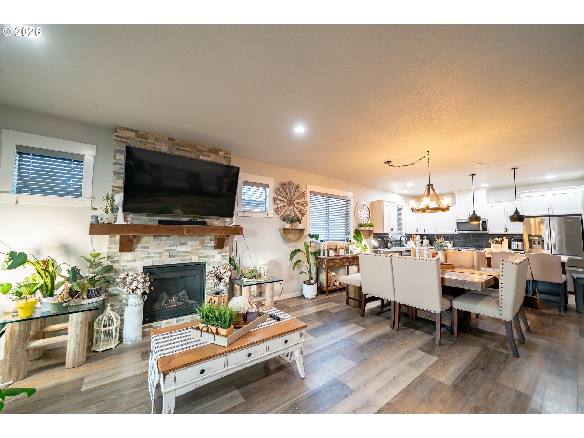 459 Northeast Cedar Street Sublimity, OR 97385 - Photo 4 of 27 a living room with furniture a flat screen tv and a fireplace