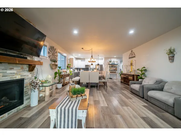 a living room with furniture fireplace and flat screen tv