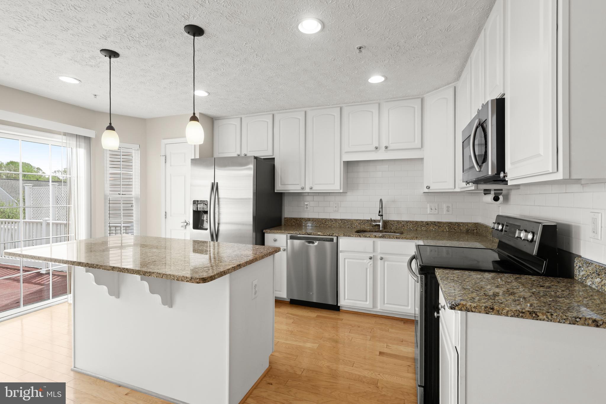 1983 Cullen Way Forest Hill, MD 21050 - Photo 11 of 50 a kitchen with stainless steel appliances granite countertop a sink a refrigerator a stove and a granite counter tops