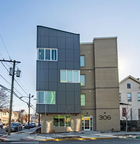 a tall building sitting on the side of a street